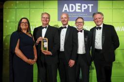 2024 ADEPT Awards - image of people holding an award, dressed for a black tie dinner